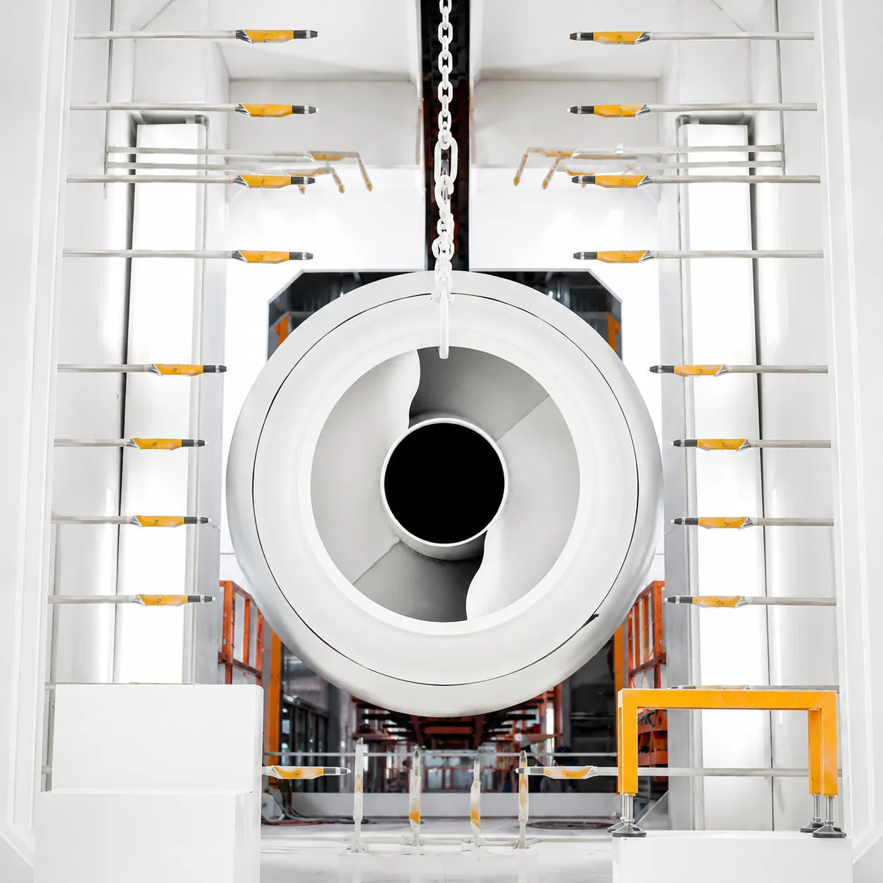 White powder coating line with a suspended industrial turbine ring