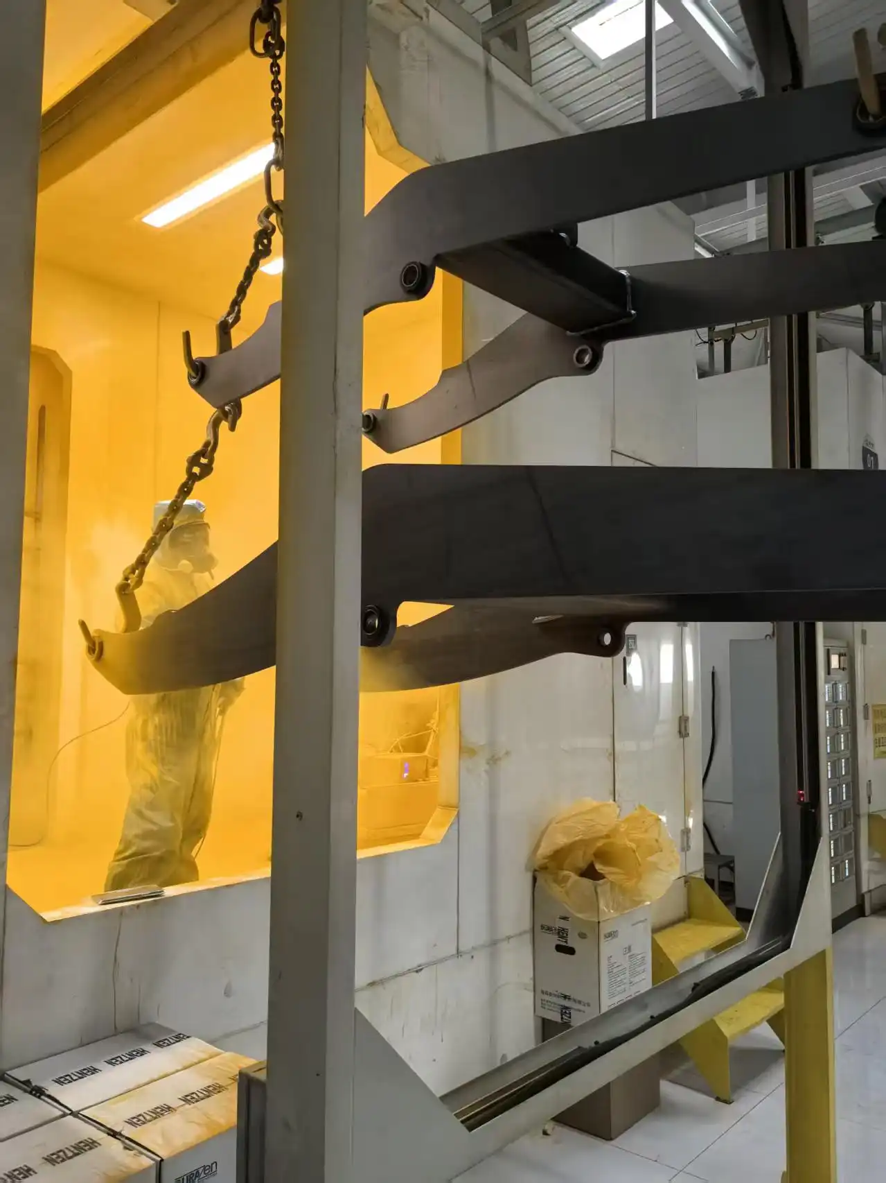 Construction equipment component coating booth