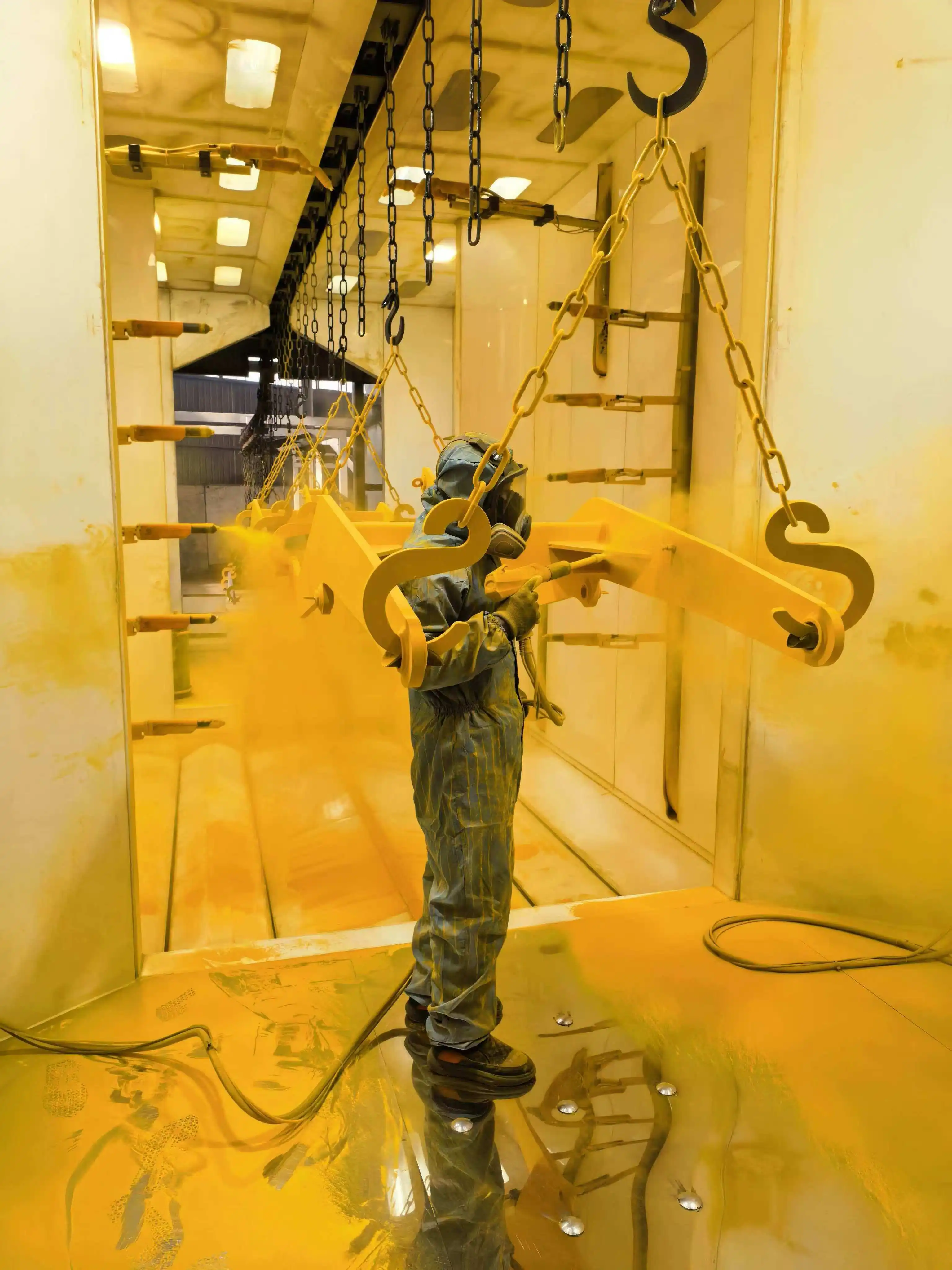 Manual coating of yellow equipment components